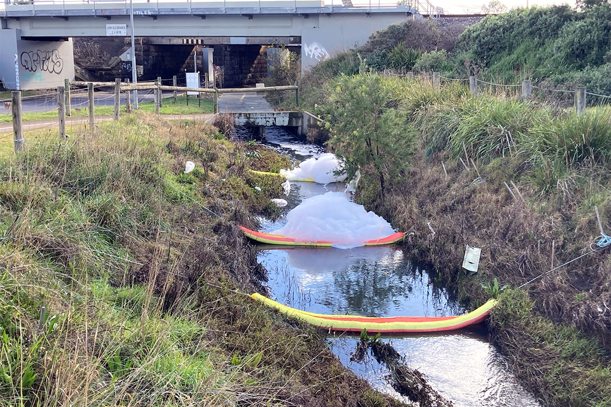 Booms across contaminated waterway at Derrimut