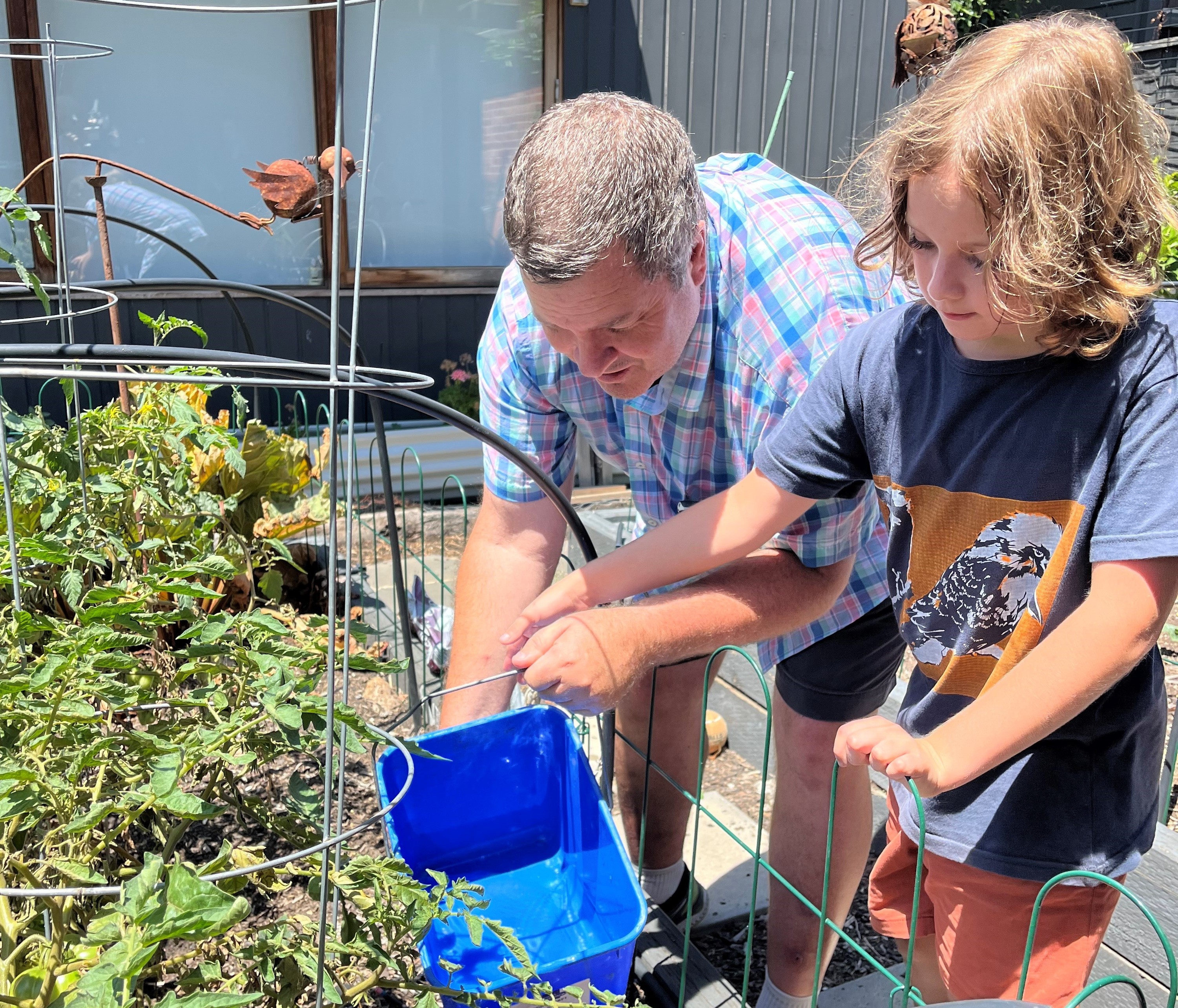 Dean and Ben use recycled water to nourish their garden.