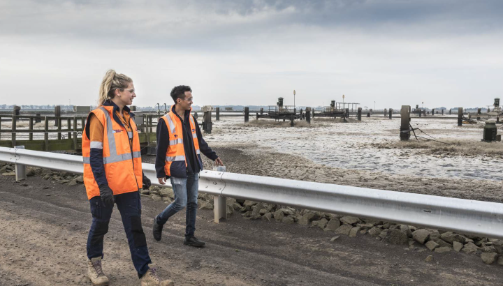 Melbourne Water colleagues walking near a lagoon at the Western Treatment Plant