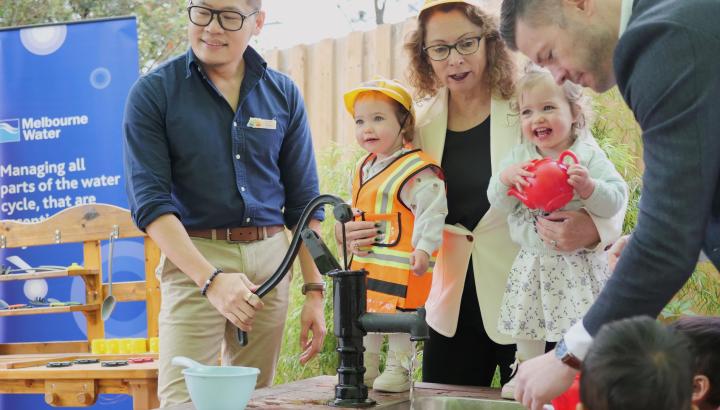 toddlers operate water pump at early learning centre in Croydon