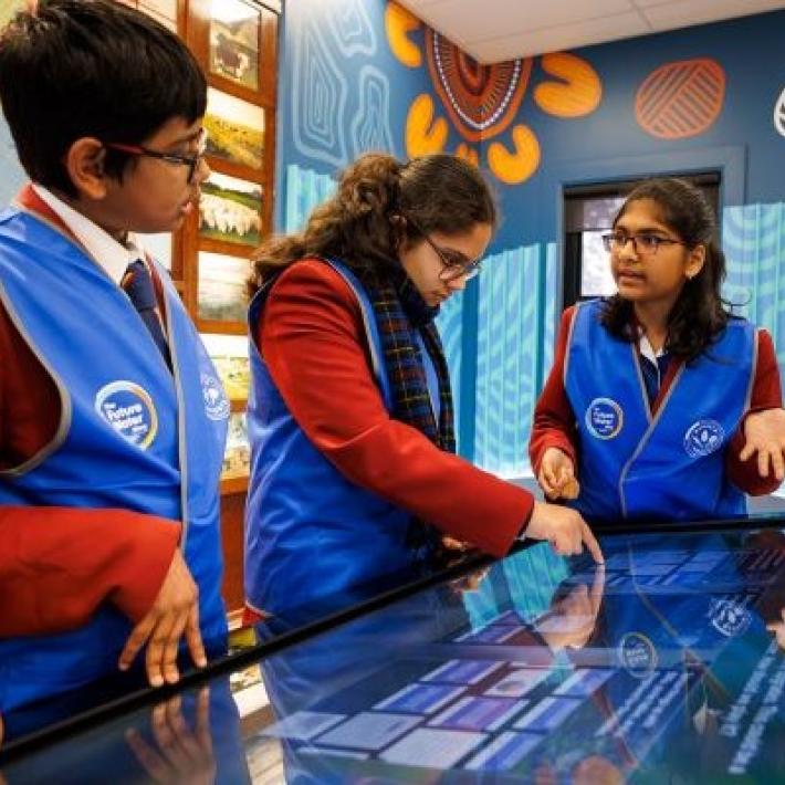 Students at touch table playing the future water story