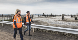 Melbourne Water colleagues walking near a lagoon at the Western Treatment Plant