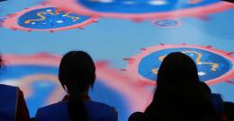 Students sit in front of circular screen at the Western Treatment Plant Education Centre