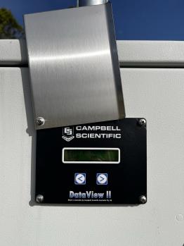 A close up view of the digital rain gauge LCD screen.