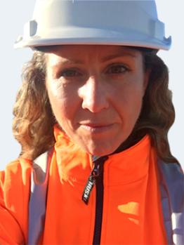 woman in high vis and helmet 