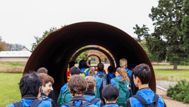 School group of students walking through series of tunnels at WTP