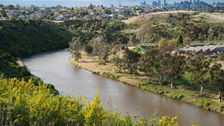 Picture of a waterway with the Melbourne skyline in the background