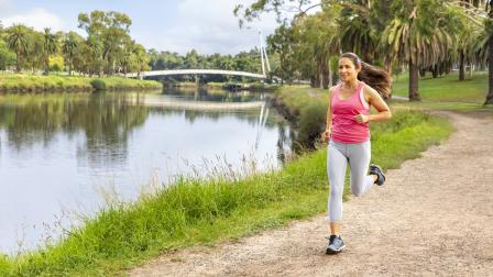 Woman jogs along the Maribyrnong River Trail